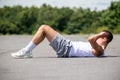 A 19 Year Old Teenage Boy Doing Situps In A Public Park Royalty Free Stock Photo