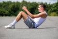 A 19 Year Old Teenage Boy Doing Situps In A Public Park Royalty Free Stock Photo