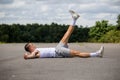 A 19 Year Old Teenage Boy Doing Situps In A Public Park Royalty Free Stock Photo