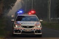 NINGI, AUSTRALIA - NOVEMBER 9 : Police holding cordon in front of bush fire front as it approaches houses November 9, 2013 in