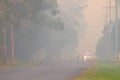 NINGI, AUSTRALIA - NOVEMBER 9 : Police holding cordon in front of bush fire front as it approaches houses November 9, 2013 in