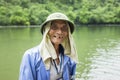 Ninh Binh, Vietnam - May 16, 2015: Close-up portrait of old tourist rowing boat man at Tam Coc travel destination, Ninh Binh