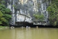 Ninh Binh, Vietnam - May 16, 2015: Exterior view of natural cave on Ngo river, Tam Coc, Ninh Binh