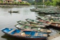 Ninh Binh, Vietnam - May 16, 2015: Tourism boats stay next to each others waiting for tourist at Tam Coc, the popular travel desti