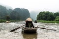 NINHBINH, VIETNAM - MARCH 17, 2019: Sightseeing Tourists traveling in small boat in Ngo Dong River, Tamcoc eco tourism at Ninh Royalty Free Stock Photo