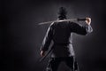 Ninja samurai with katana stands with his back to the viewer Royalty Free Stock Photo