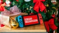 Nintendo Switch with Merry Christmas message and a christmas tree in the background