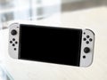 Nintendo Switch OLED Model in handheld mode. Popular mobile gaming console