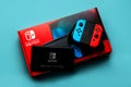 Nintendo Switch video game console box with Nintendo Switch logo, Back of Nintendo Switch and two Joy-Cons Royalty Free Stock Photo