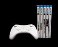 Nintendo Wii u pro controller and games Royalty Free Stock Photo