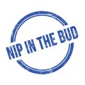 NIP IN THE BUD text written on blue grungy round stamp