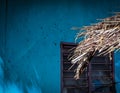 Nipa palm dried leaves with on a modern house background Royalty Free Stock Photo