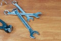 Nippers and wrench on wooden background plumber worker tool