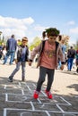 Leap into Learning: Little Girl Jumping on Chalk Marked Squares and Numbers in the Park