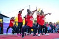 Enchanting Dance Performance by Young Girls in Red Shirts and Black Pants for International Dance Day