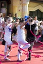 Female kids dancing with colorful ribbon on stage Royalty Free Stock Photo