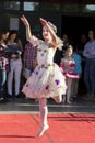 Joyful Performance: Young Small Ballerina Radiates Happiness on the Public Stage for World Dancing Day Royalty Free Stock Photo