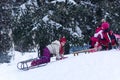 Young girl with sled enjoying on snow in hills city park