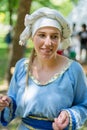 Enchanting Medieval Beauty: Portrait of a Woman in Traditional Blue Dress at Knight Festival