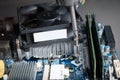 Installation processor cooler on motherboard with screwdriver