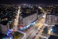 Enchanting Nighttime Cityscape: Nis Illuminated by Glowing Buildings and Car Lights