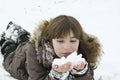 The nise girl lays with snow in hands