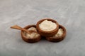 Nisin powder in wooden bowl. Food additive E234 for protection from spoilage of meat, fish, sausage products, including raw smoked