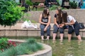 Serene Summer Bliss: Teenagers Cooling Off and Engaging in Conversations