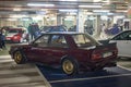 Nissan Bluebird T12 T72 Series in deep maroon red color tuned for street racing Royalty Free Stock Photo