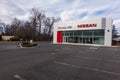 A Nissan car dealership with its parking lot almost empty due to a supply chain disruptions of materials used to manufacture new