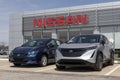 Nissan Leaf and Ariya display at a dealership. Nissan offers the Leaf and Ariya EV Electric Vehicles to help lower emissions