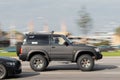 Nissan Patrol rebuilt for off-road use. A black SUV is driving down the street. Motion blur. Riga, Latvia - 09 Sep 2021 Royalty Free Stock Photo