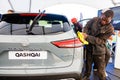 Nissan Qashqai E-Power electric vehicle being polished on display