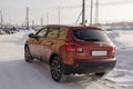 Nissan Qashqai in red color. This is crossover that combines modark design and compact hatchback refinement with functionality