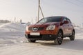 Nissan Qashqai in red color. This is crossover that combines modark design and compact hatchback refinement with functionality