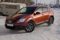 Nissan Qashqai in red color. This is crossover that combines modark design and compact hatchback refinement with functionality