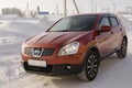 Nissan Qashqai in red color. This is crossover that combines modark design and compact hatchback refinement with functionality