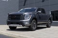 Nissan Titan display at a dealership. Nissan offers the Titan in King Cab and Crew cab models