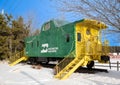 NISSWA MN - 24 DEC 2021: Green train caboose on sunny winter day