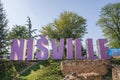 Vibrant Jazz Vibes: Nisville Sign and Purple Text at the International Jazz Festival