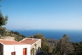 Nisyros village house with sea and trees