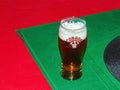 Close-up of a glass of fresh Slovak foamy beer \