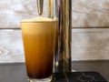 Nitro Cold Brew coffee in a clear glass