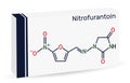 Nitrofurantoin molecule. It is nitrofuran antibiotic used to treat urinary tract infections. Paper packaging for drugs