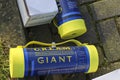 nitrous oxide or laughing gas cylinder for recreational drug usage left on street with balloons