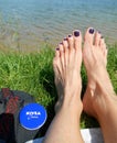 Nivea cream and female barefoot outdoor