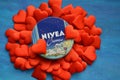 Nivea cream product and red hearts blue background Royalty Free Stock Photo