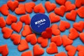 Nivea cream product and red hearts blue background Royalty Free Stock Photo