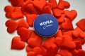 Nivea cream product and red hearts white background Royalty Free Stock Photo