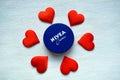 Nivea cream product and red hearts white background Royalty Free Stock Photo